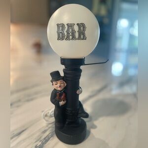This item is a vintage Charlie Chaplin themed bar lamp.
